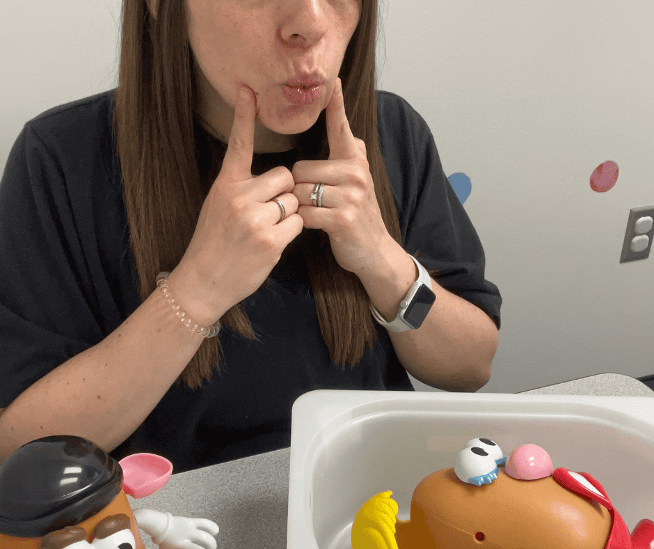 Speech Therapist working with a child showing sounds